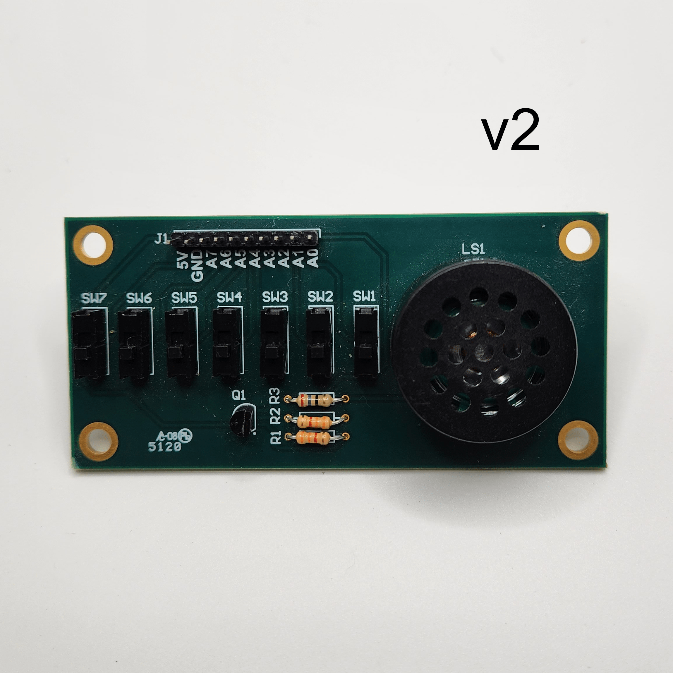 Complete populated Simple Switch and Speaker Demo Board v2 PCB with a text label indicating what version board it is
